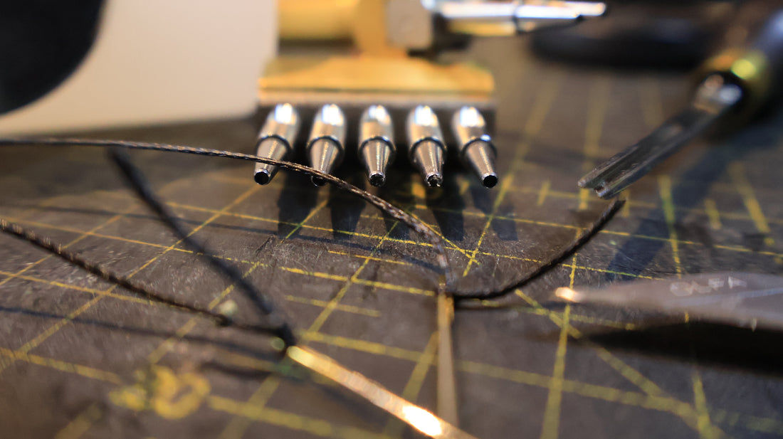 Leather craft tools on a cutting mat