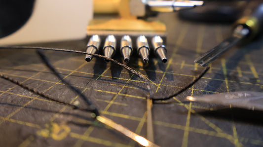 Leather craft tools on a cutting mat